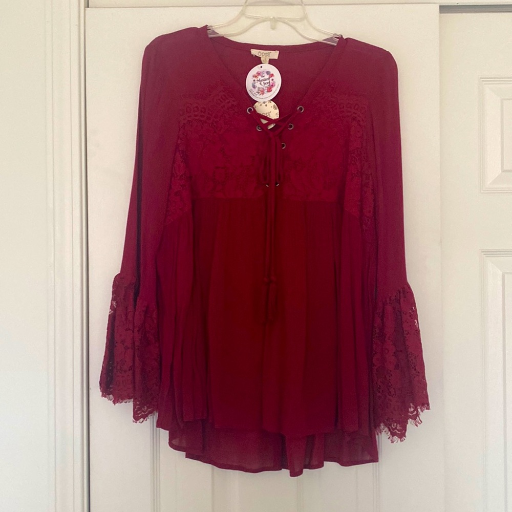 Red lace blouse with bell sleeves